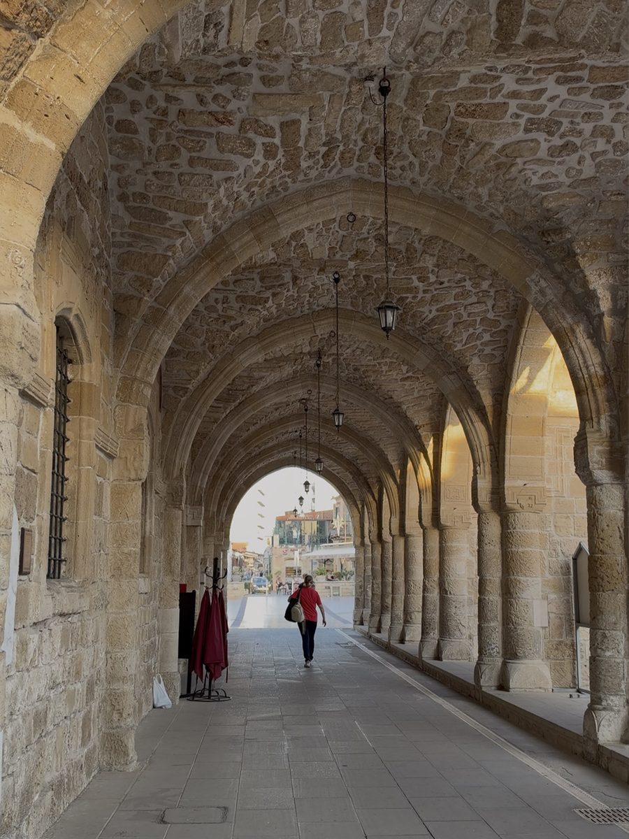 Gothic stone arcade with hanging lanterns at the Church of Saint Lazarus in Larnaca
