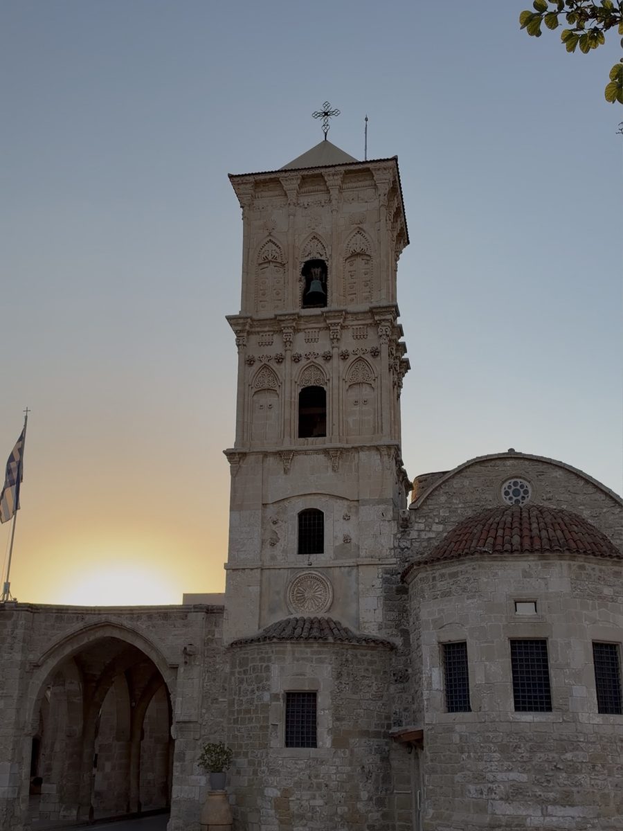 Carved stone bell tower of the Church of Saint Lazarus in Larnaca at sunset