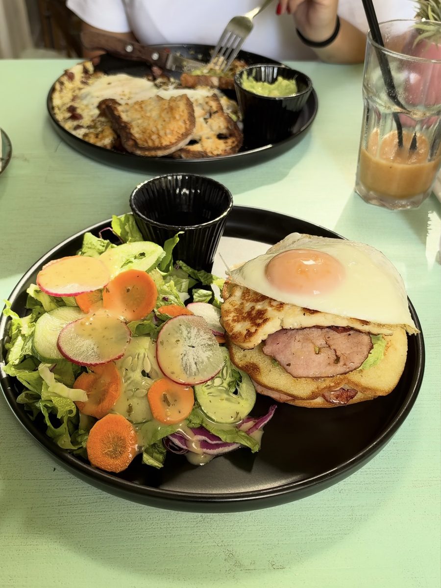 Pancake stack with ham, cheese and a fried egg, with a side salad, at Happy Avogato in Larnaca