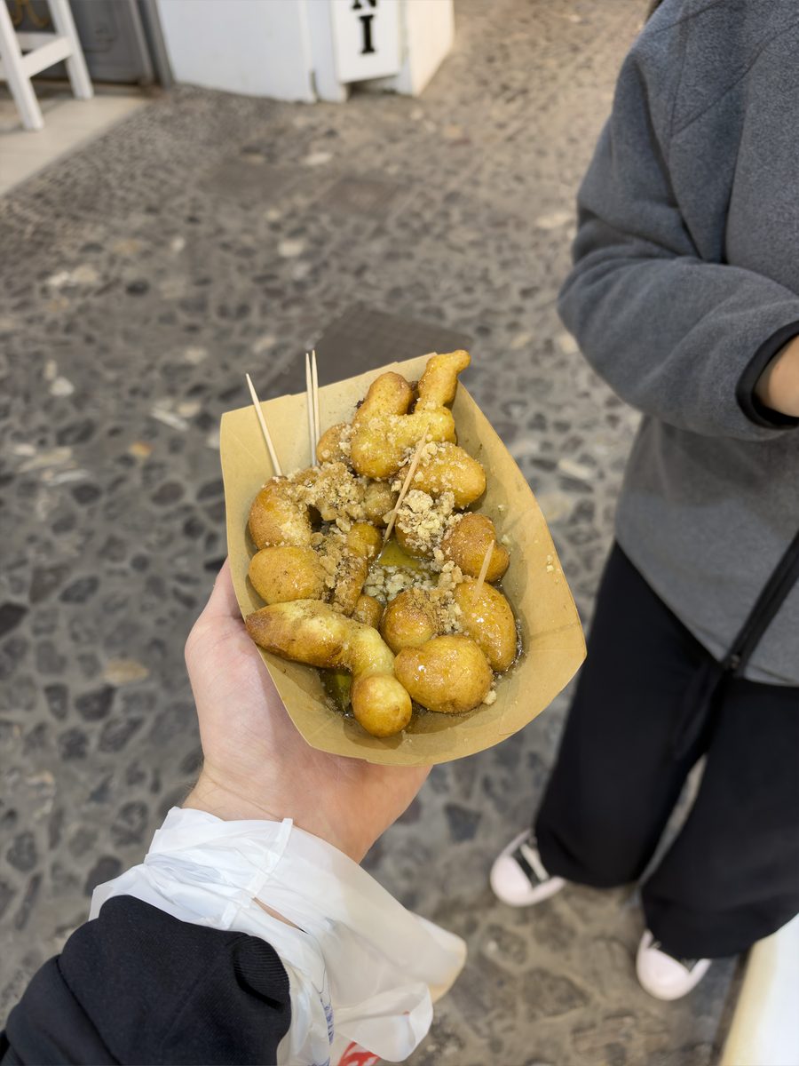 Original loukoumades with honey, cinnamon and crushed nuts from La Petite in Fira, Santorini