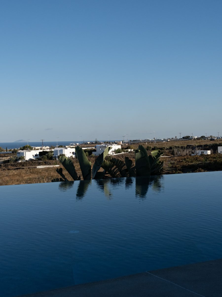 Infinity pool at Magma Resort Santorini looking out over the countryside to the sea