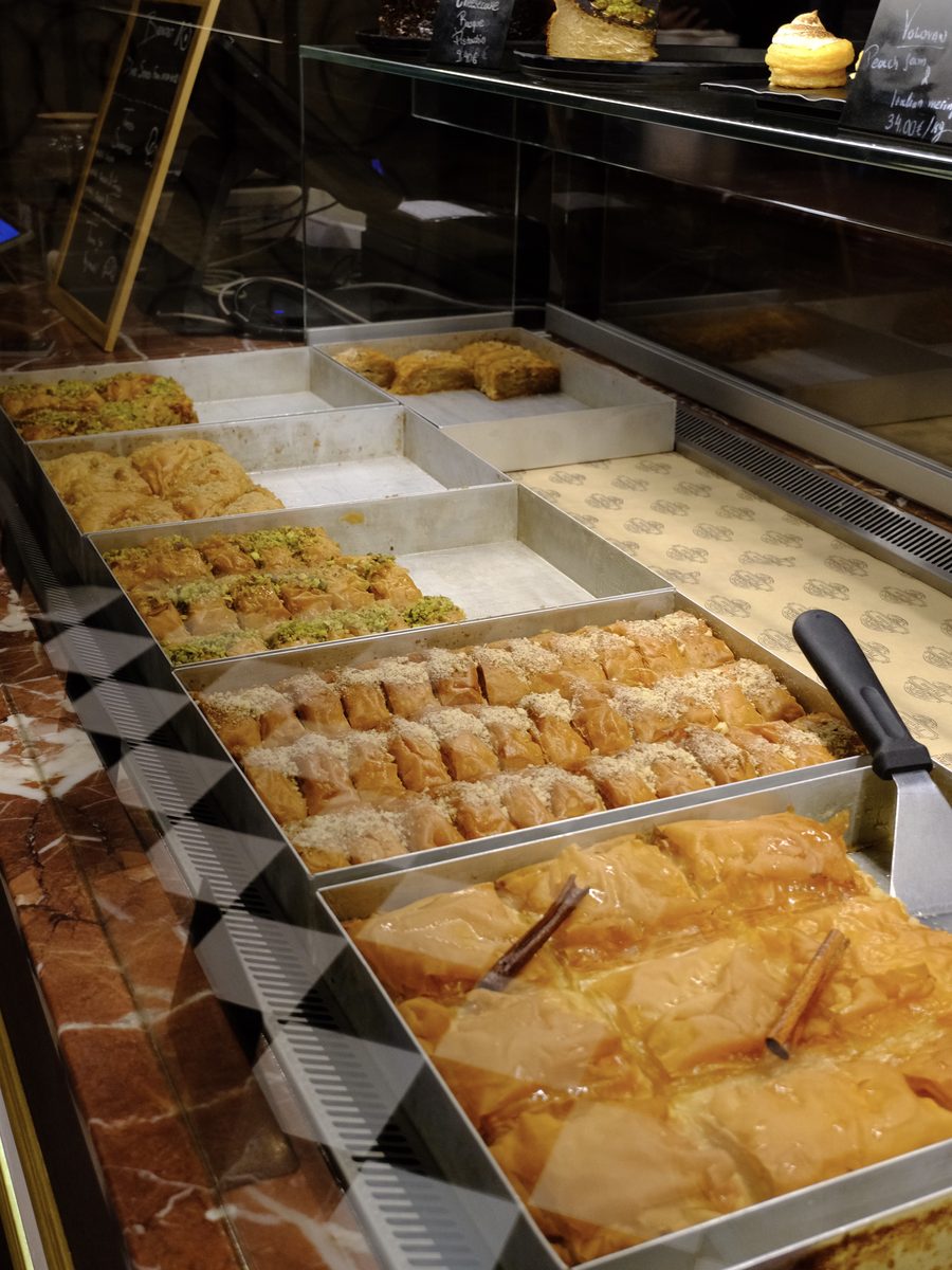 Trays of baklava with pistachios and walnuts at Phyllon bakery in Oia, Santorini