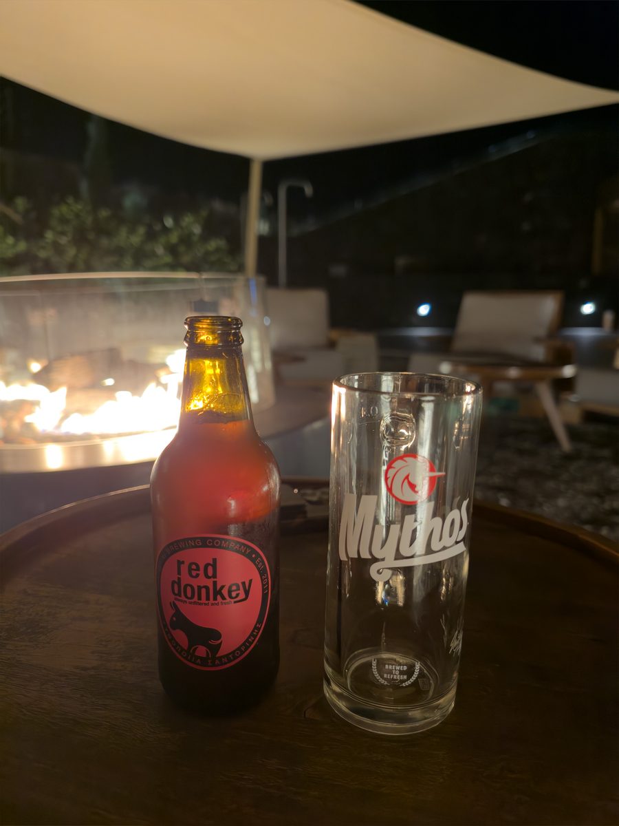 Red Donkey beer from the Santorini Brewing Company next to a fire pit at Magma Resort, Santorini